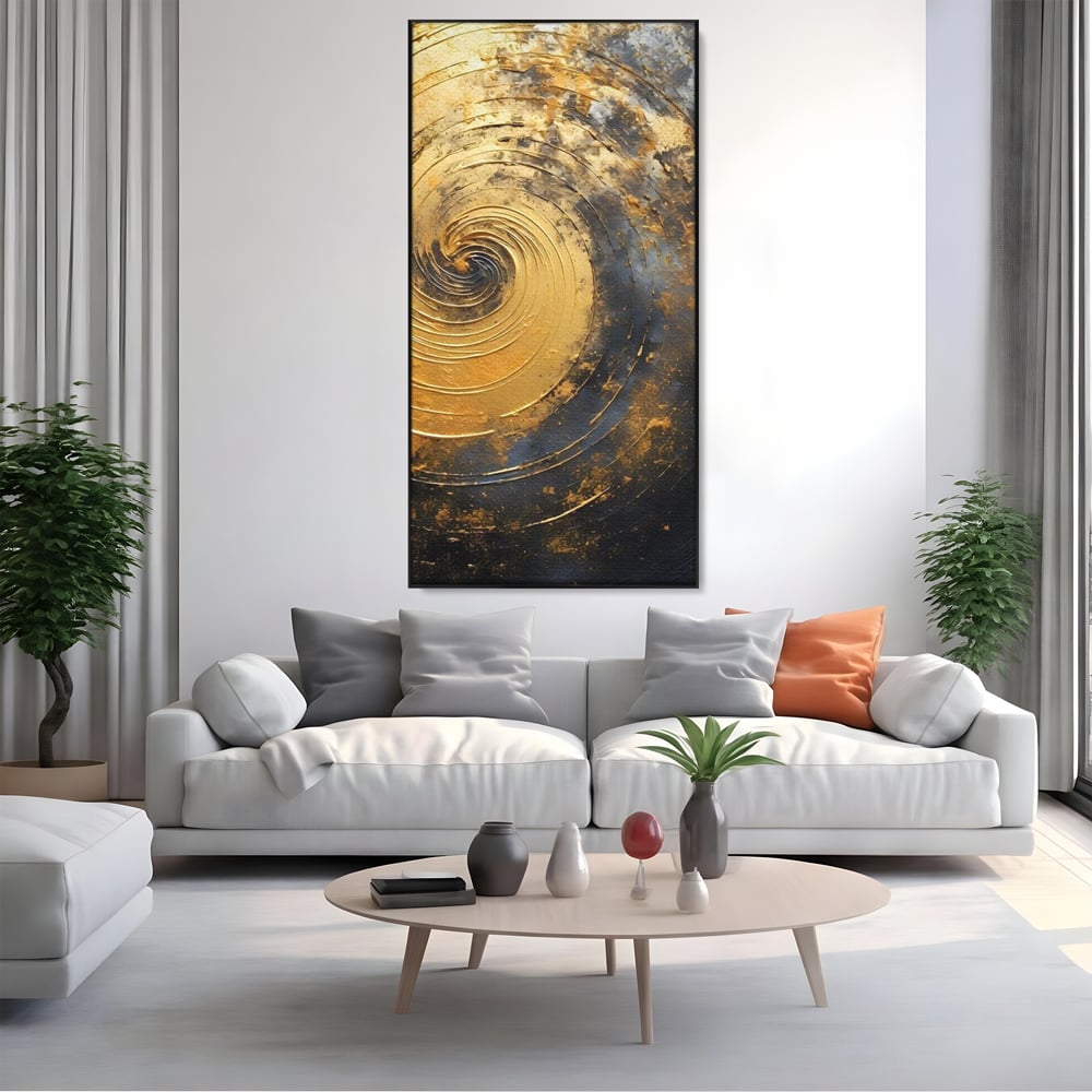 Tablou canvas cu pictura abstracta cu spirala aurie, in rama de aluminiu negru, pe perete intr-un living